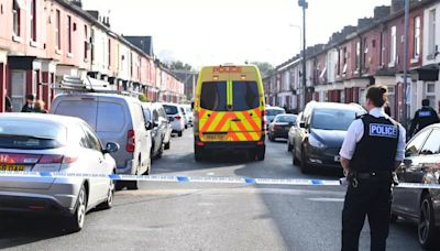 Road cordoned off after man injured in the street