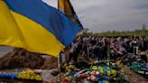 Long days of gravediggers tell story of Ukraine's war dead