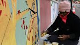 Artists paint murals on 5th Street as part of new project; murals to be unveiled Saturday