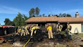 Firefighters respond to vegetation fire that spread to garage in Redding