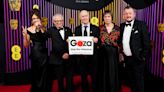 Veteran filmmaker Ken Loach poses at Baftas with sign calling for Gaza ceasefire