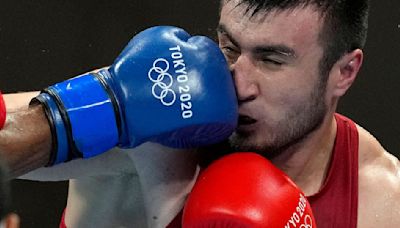 Beleaguered Olympic boxing has a new look in Paris: Gender parity, but the smallest field in decades