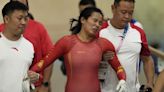 China track cyclist Yuan Liying has to be helped off velodrome after causing hard keirin crash - TSN.ca