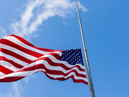 Why are flags at half-staff on Friday in Virginia?