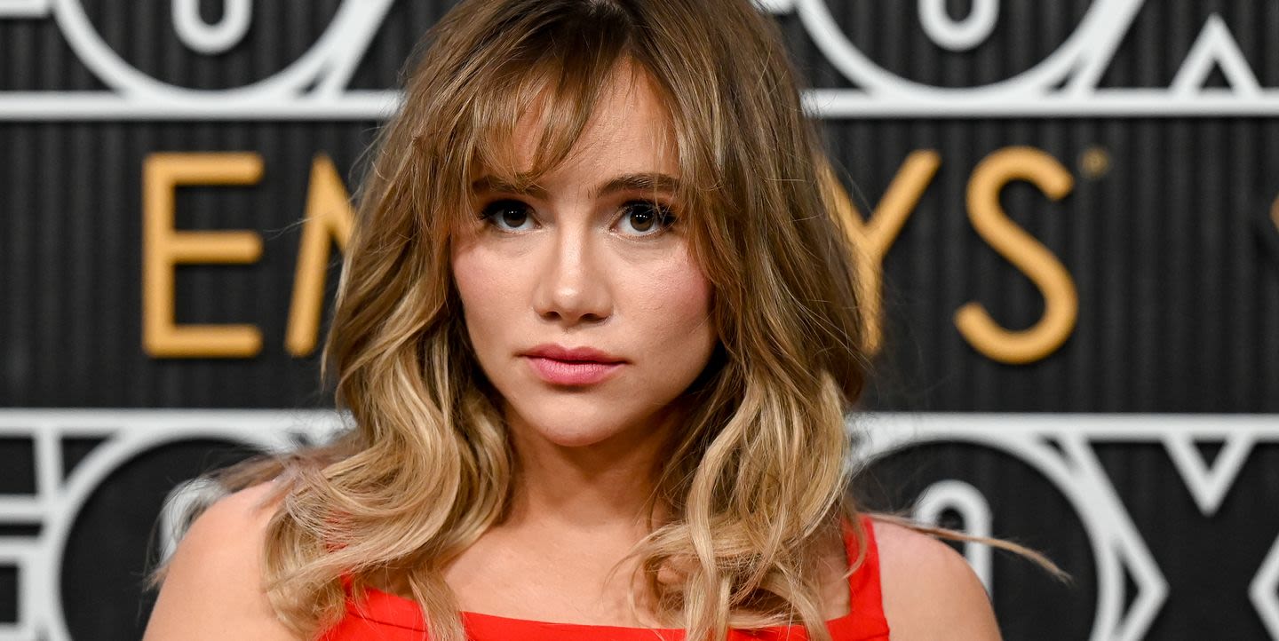 Suki Waterhouse tops off her layered bouffant with a retro starry tiara