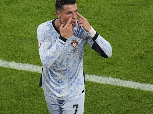 Watch horrifying video: After shocking Portugal- Georgia defeat, Christiano Ronaldo escapes injury by whiskers as fan jumps.