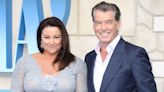 Pierce Brosnan's wife looks radiant in all white as she's reunited with 007 star