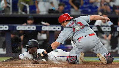 Winn's homer in 12th, Carlson's throw lead Cardinals over Marlins for 1st winning record since April