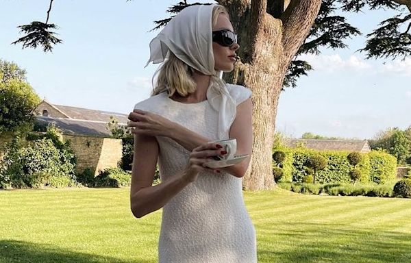 Elsa Hosk Pairs Her Knitted White Midi Dress With Chunky Thong Sandals