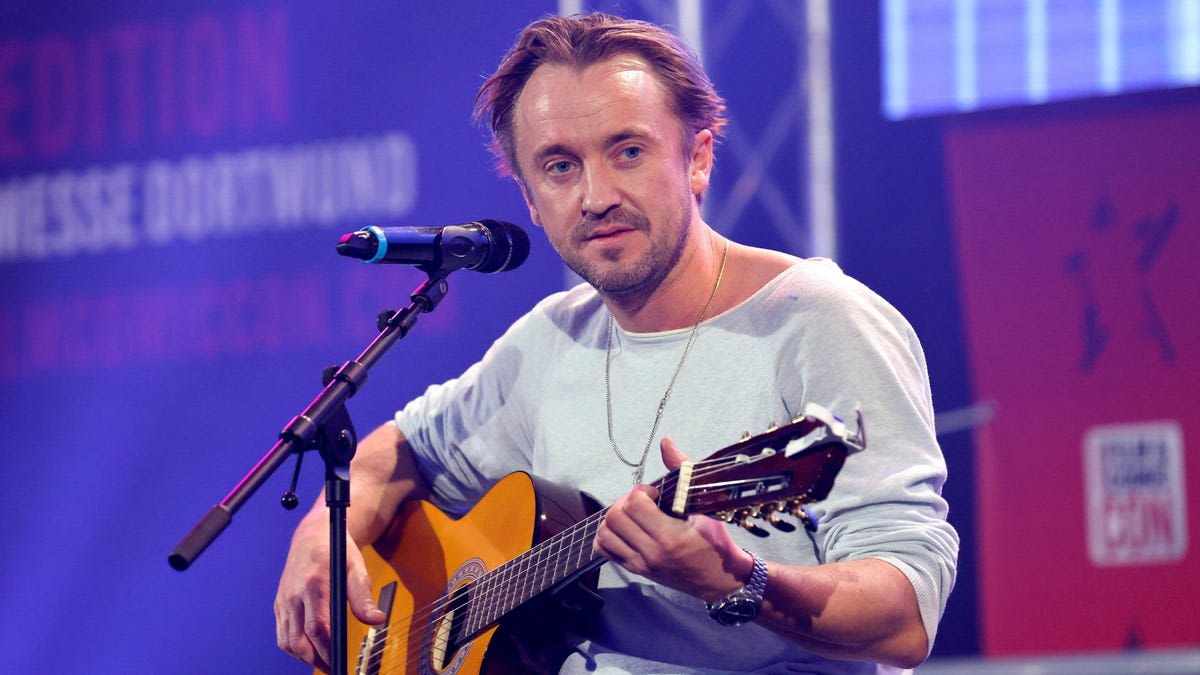 Tom Felton is filming a show about Gandhi, releasing new music