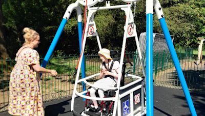 Mum celebrates as wheelchair swing installed at park after years of campaigning