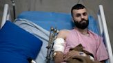 A Palestinian was shot, beaten and tied to an Israeli army jeep. The army says he posed no threat