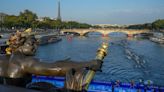 Paris Olympics organizers say swimming events still set for the cleaned-up Seine after heavy rains