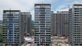More Chinese Cities Move to Buy Up Housing Inventories