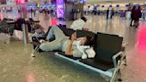 Holidaymakers hunker down for the night at Heathrow