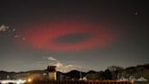 Eerie ring of red light flashes like a massive UFO above Italy. What was it?