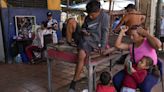 Venezuelans turn to odd jobs and gambling to stretch meager wages they hope will grow after election