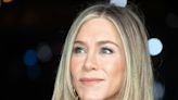 Jennifer Aniston Dominates the Red Carpet in Body-Hugging Shimmery Champagne Gown