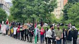 Hundreds of Pro-Palestinian protesters march before some set up tents at Drexel University