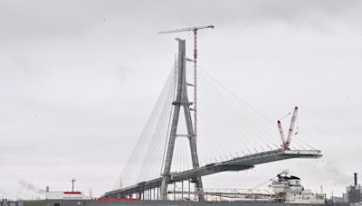 Workers link US, Canadian sides of new Gordie Howe International Bridge over Detroit River