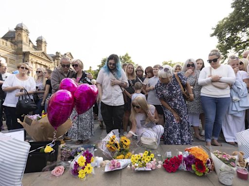 Police clash with an unruly crowd gathered near the site of UK stabbing attack that killed 3 girls