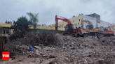 Surat building collapse toll hits 7, woman rescued | India News - Times of India