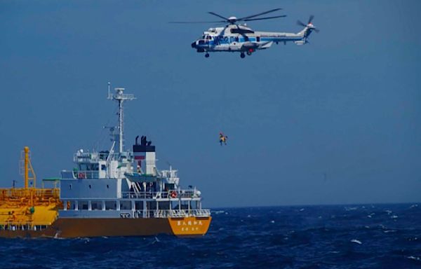 Woman swept to sea while swimming at a Japanese beach rescued 37 hours later and 50 miles away