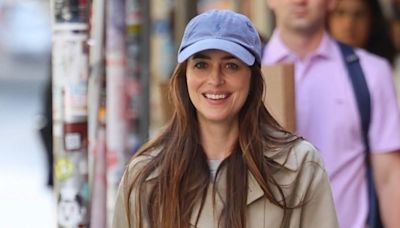 Dakota Johnson Sports Trenchcoat & Baseball Hat on ‘Materialists’ Set in NYC