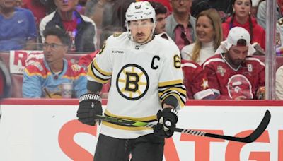 What happened to Brad Marchand? Injury update on Bruins star sidelined by Sam Bennett hit | Sporting News