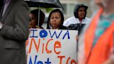 Iowa law allows police to arrest and deport migrants. Civil rights groups are suing