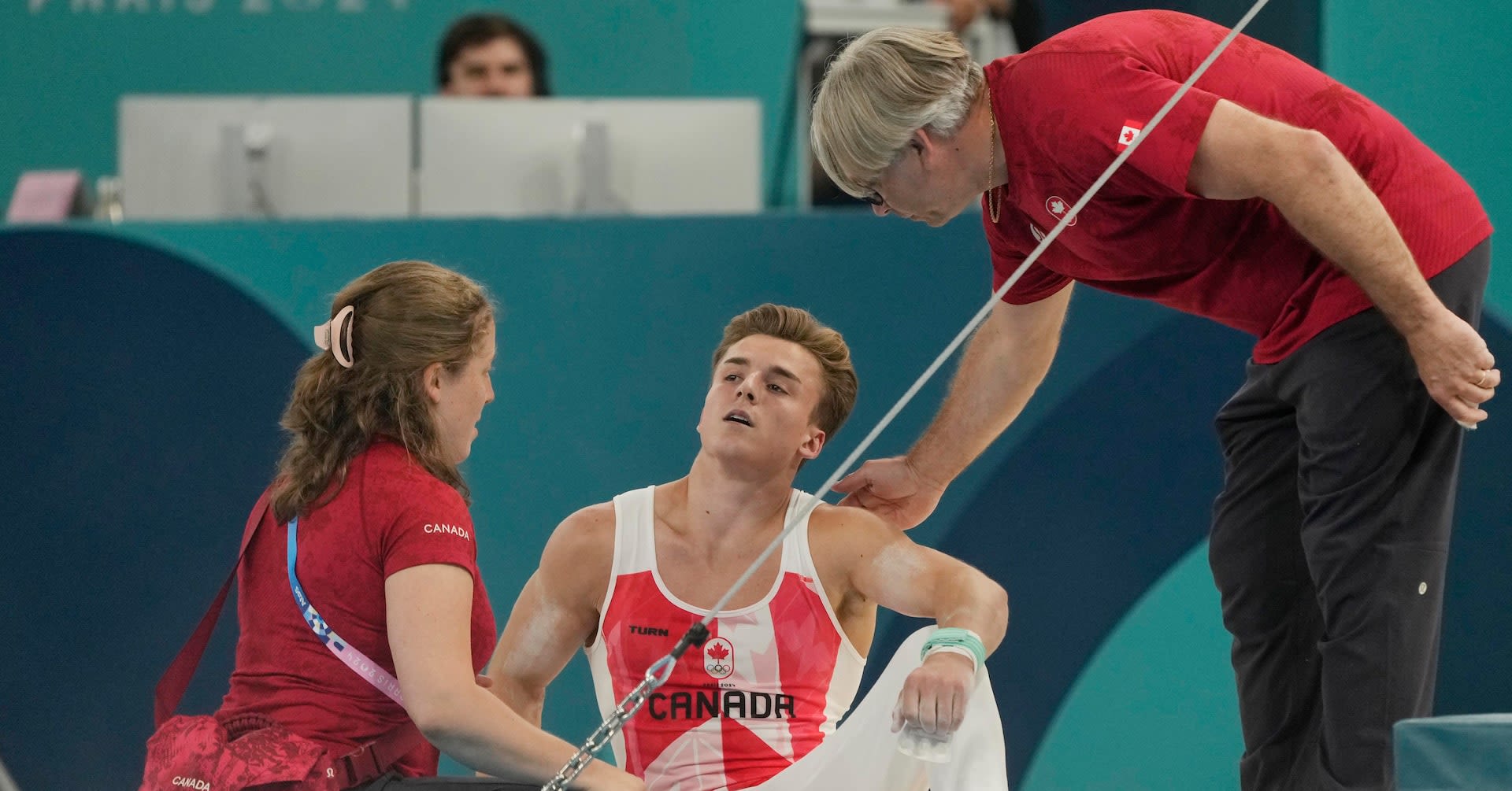 Gymnastics-Canada's Dolci gets second chance on bar after equipment malfunction