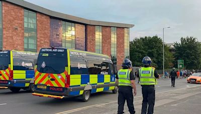 Protest in Manchester erupts into scenes of violence as man dragged off bus and rocks and bottles pelted at police