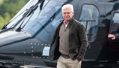 Philip Schofield arrives at Silverstone by helicopter