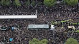 Iran's Raisi buried in Mashhad as mourners pack Iranian holy city