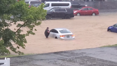 Dollywood flash flooding leaves visitors wading through waist-deep water to escape washed-out park