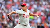 Phillies wait out an extra-inning rain delay, then outlast the Orioles 5-3 in 11