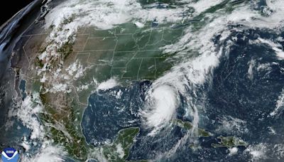 Tropical Storm Debby moves through Gulf toward Florida with hurricane warnings