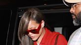 Rihanna puts on VERY leggy display in racy red cutout coat in Paris
