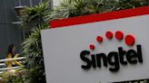 Singtel falls up to 3% after $2.3 billion impairment