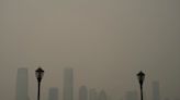 ‘Apocalyptic’ photos capture smoky haze blanketing New York City as moon turns red and air alerts raised