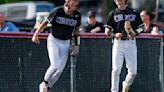 Paul Halfacre talks with Mascoutah senior Camden Mueller and junior Austin Musso after the Indians defeated Triad 5-0 on Monday afternoon