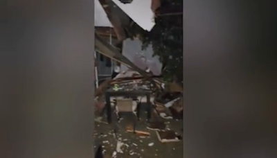 Fallen tree smashes through house after powerful thunderstorms hit Iowa and Nebraska