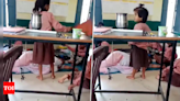 Teacher ‘napping’ in class benched, staffer sacked for making videos | Agra News - Times of India