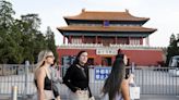 China lures tourists with easy entry, but tough sell for some
