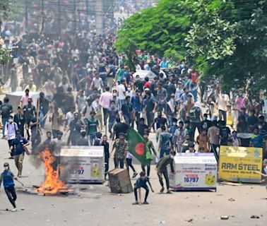 Bangladesh protesters set state TV HQ ablaze as toll mounts, internet cut