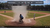 Dust devil surprises youth baseball player in Florida. Watch umpire spring into action