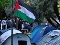 A Palestinian flag flies at an encampment on the University of Valencia campus in Spain, part of protests spreading around the world after they began on campuses in the United States