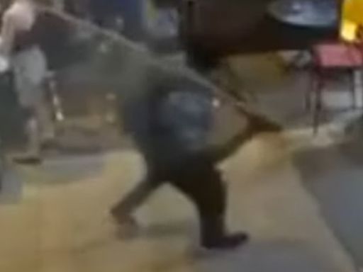 Shocking moment stranger smashes bargoer with piece of wood in unprovoked attack