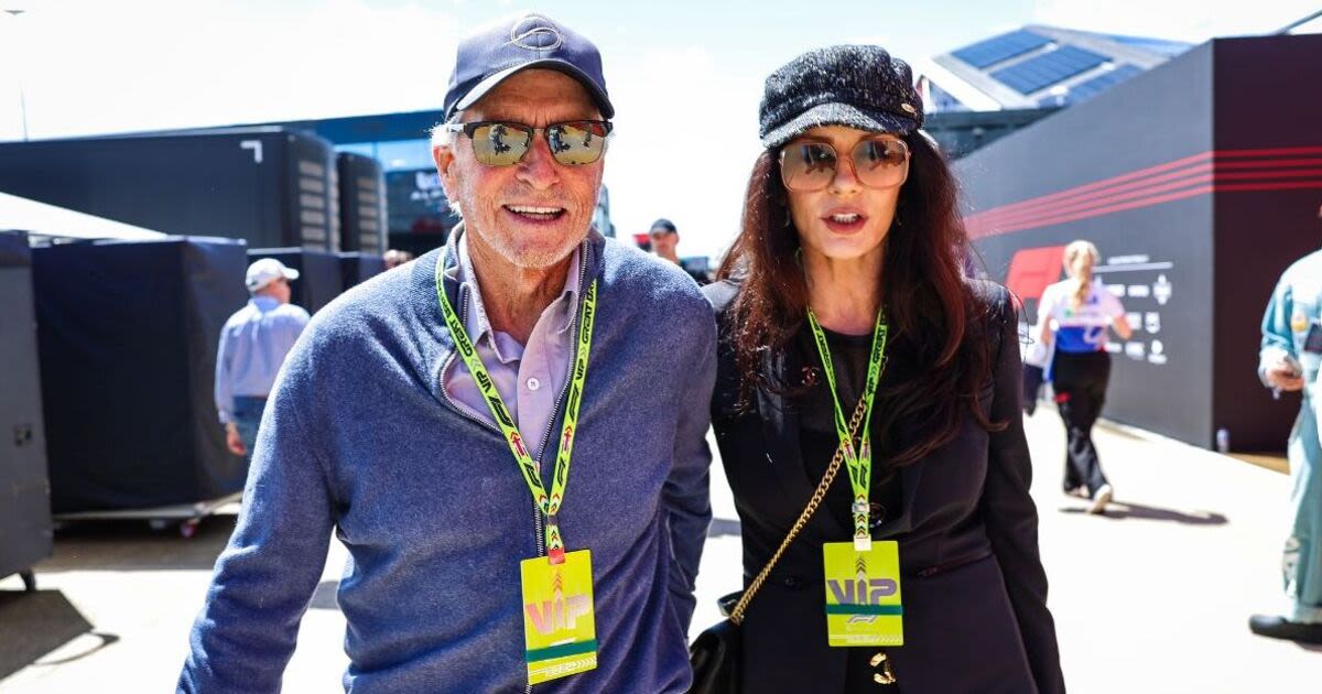 Michael Douglas and Catherine Zeta-Jones pack on the PDA at Grand Prix