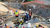 Rescuers contact some workers alive in the rubble of a deadly building collapse in South Africa